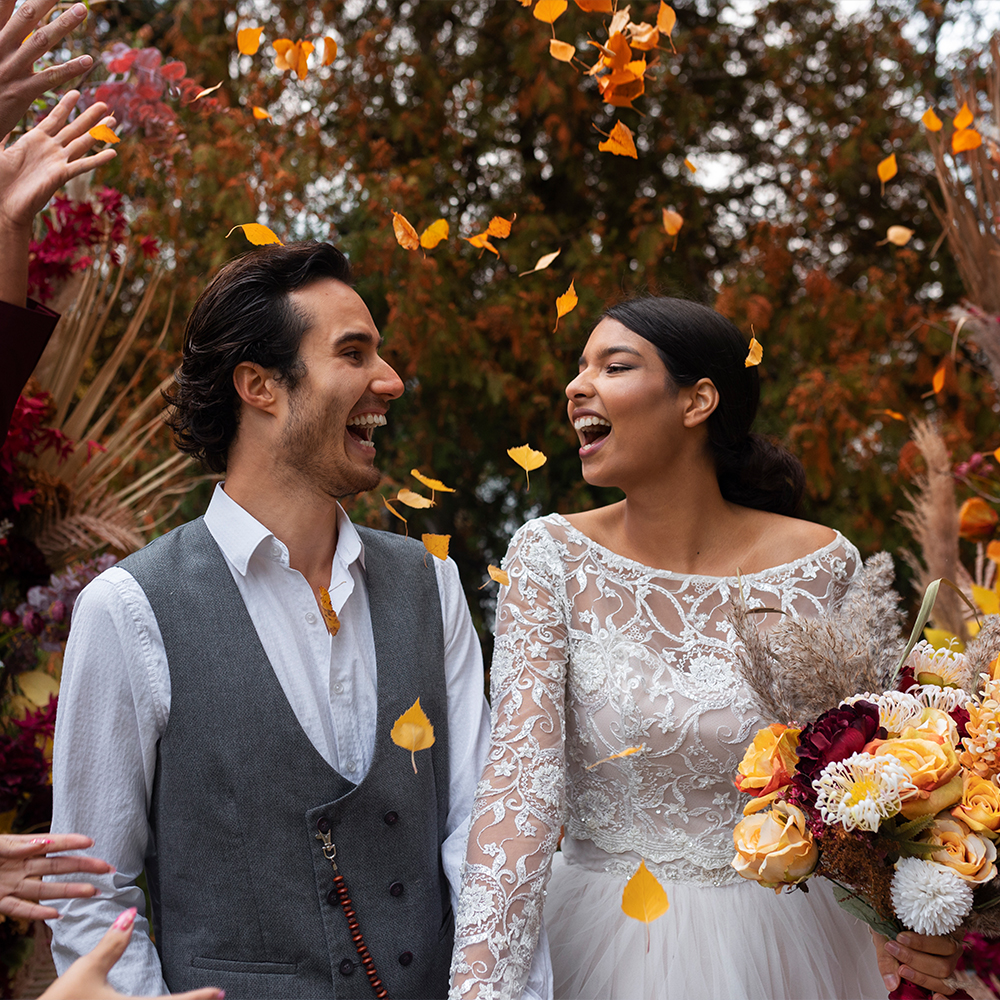 Happy couple celebrating at a wedding party.