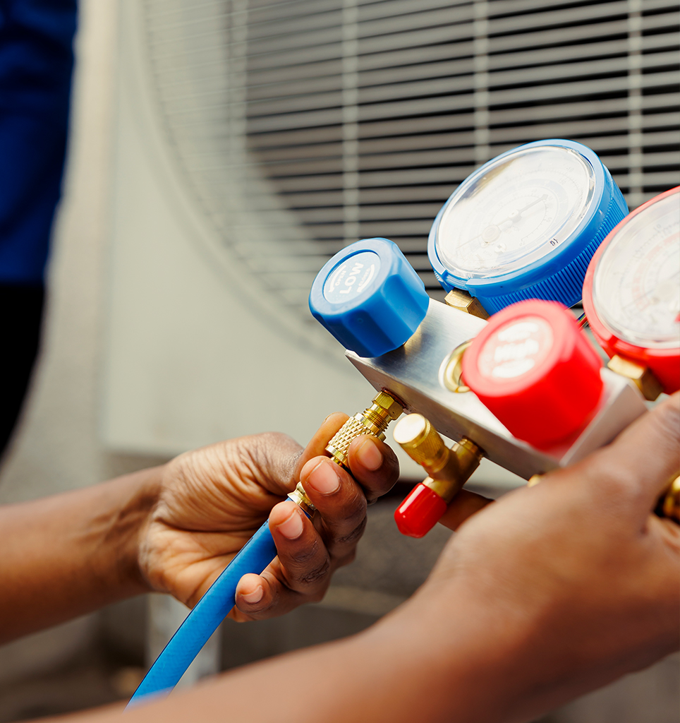 HVAC Technician checking AC refrigerant